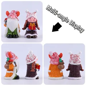 Set of two Christmas resin gnome figurines with reindeer hat and gift bags for tabletop decor