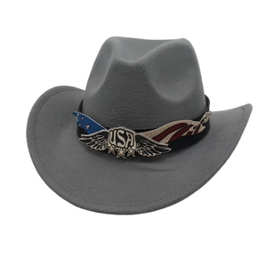Detail of grey felt cowboy hat featuring a USA wing star badge and patriotic band