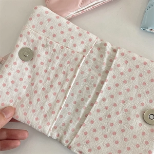 Internal view of bow polka dot fabric passport holder with metal magnetic snap closure