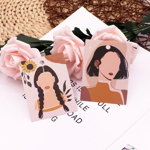 Macro shot of stylish jewelry display cards featuring elegant female hand-drawn illustrations