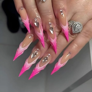Long stiletto press-on nails with rose pink gradient, 3D embossed texture, and crystals