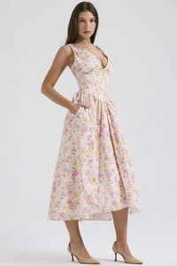 Detail of floral V-neck midi dress with corset waist and functional side pockets
