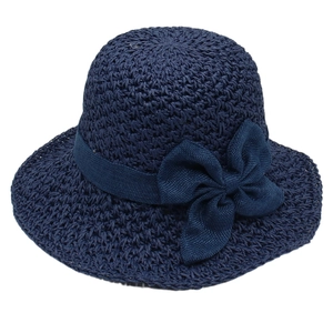 Navy blue woven straw cloche hat with an elegant ribbon bow for summer beach outings