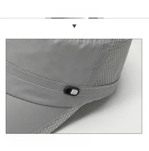 Macro view of grey flat top cap showing breathable mesh panels and fine stitching details