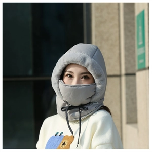 Detail view of an Asian woman wearing a gray windproof winter hat with face mask