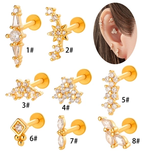 Set of 8 gold flower and star titanium ear studs with sparkling cubic zirconia stones