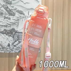 Close-up of 1000ml gradient sports water bottle with pink strap and time scale reminders