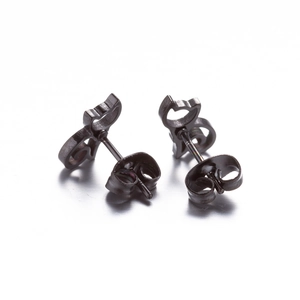 Detail of matte black stainless steel cat-shaped stud earrings with butterfly backs