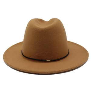 Detail of camel wool fedora hat featuring a minimalist black band and gold buckle accent