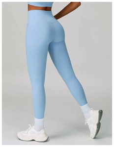 Detailed close-up of high-waisted baby blue yoga pants with butt-lifting seam and elastic fabric