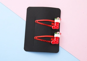 Pair of festive red glitter BB hair clips featuring cute 3D resin Christmas socks