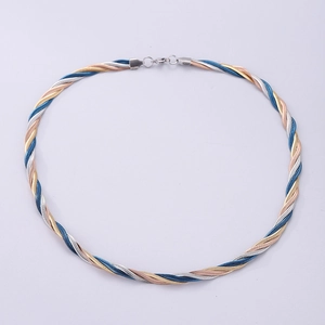 Close-up of twisted 6mm snake chain necklace in gold silver and blue stainless steel