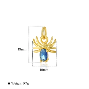 Detailed macro of gold spider pendant with blue gemstone and dimensions 13mm by 10mm