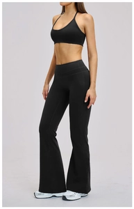 Side view of black brushed yoga set featuring cross-back sports bra and flared leggings