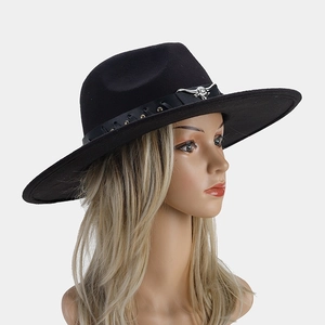 Detail of black wool fedora with woven leather band and silver bull head metal ornament