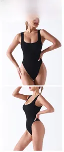 Detail view of black ribbed compression yoga bodysuit featuring U-neck and wide straps