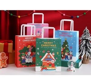 Detailed view of Christmas paper gift bags with handles and festive cartoon illustrations