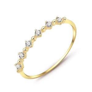Slim stackable 18K gold plated silver ring with seven sparkling round cubic zirconia stones