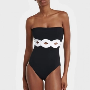Minimalist black and white cutout one-piece swimsuit with chic waist ring detail
