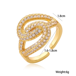 Detail of 18K gold plated knot ring with zircons showing 1.8cm size and 6g weight