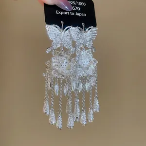 Elegant S925 silver butterfly earrings with floral hollow design and tiered tassels