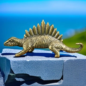 Detailed view of bronze stegosaurus dinosaur figurine with fine skin textures and plates