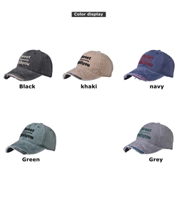 Flat lay of vintage washed baseball caps in five colors with embroidered lettering