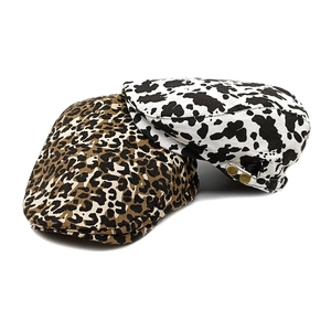 Retro flat top ivy caps with leopard and cow print patterns and vintage metal side buckles