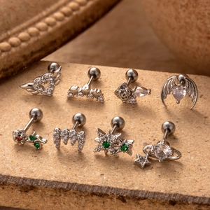 Set of 8 stainless steel cartilage earrings with silver hearts, stars, and green gems