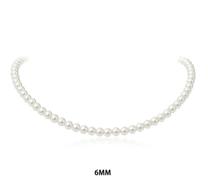 Macro detail of 6mm white glass pearls featuring a high-luster round finish necklace