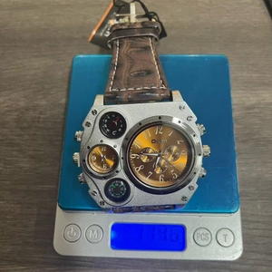 Detailed top view of large Oulm dual timezone watch on scale showing 119.6g weight