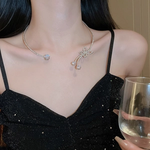 Elegant silver butterfly choker necklace with sparkling zircon tassels on a woman model