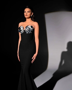 Detail of elegant black mermaid dress featuring striking 3D silver floral appliques