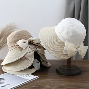 Elegant women straw stitching sun hats with large bow detail for outdoor UV protection