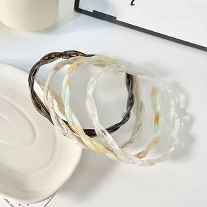 Minimalist twisted acetate headbands in assorted colors with non-slip inner teeth