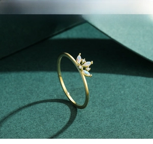 Macro view of 925 silver crown ring with marquise opal stones and 18K gold finish