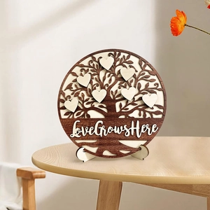 3D hollow wooden family tree ornament with Love Grows Here slogan on desk stand
