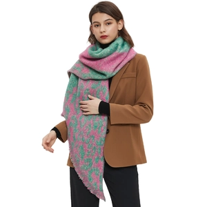Pink and green plaid boucle scarf for women shown on model with soft plush texture