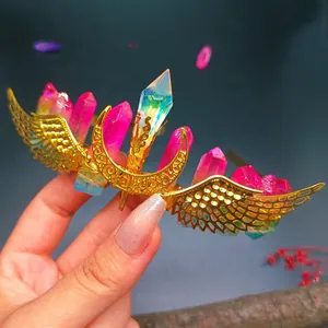 Handmade gold wing crown featuring pink crystals and iridescent quartz pillars