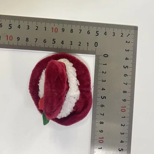 Detailed view of plush red and white Christmas wine bottle hat measuring 9cm by 9cm