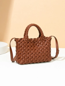 Brown woven leather tote bag with top handle and shoulder strap on white platform
