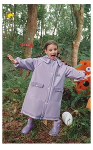 Detail of children's purple raincoat with stripes, giraffe print and matching boots