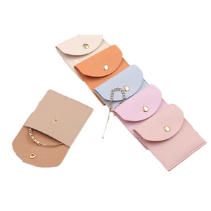 Microfiber faux leather jewelry pouch in multiple colors with snap closure for travel
