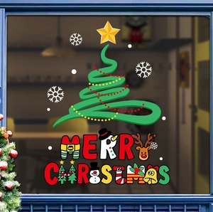 Detail of Christmas window stickers featuring reindeer and bells on glass surface