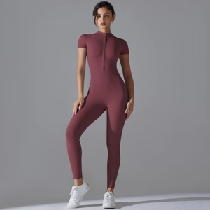 Close-up of slim fit athletic jumpsuit with front half-zipper and high elastic fabric