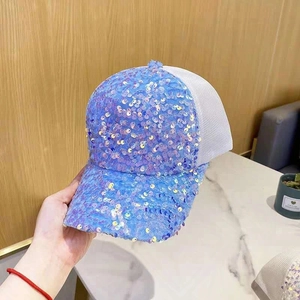 Blue sequin baseball cap with white breathable mesh for sun protection shown in hand