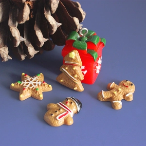 Close-up of resin Christmas miniatures gingerbread man and tree for DIY crafts
