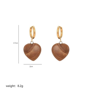 Detail of heart-shaped stone earrings in gold finish with precise size and weight dimensions