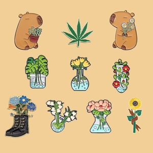 Set of 10 cute capybara enamel pins with lab flasks and floral motifs for clothing