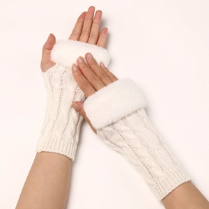 Close-up of cable knit fingerless gloves in beige with thick faux fur trim on the wrist